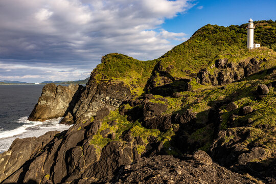 Rocky coastline and lighthouse on Ishigaki Island, Japan