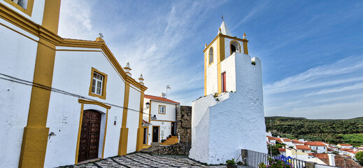 The Clock Tower and the Mother Church of Sao Joao Baptista in Alegrete, Portugal.