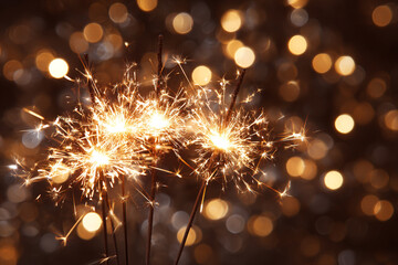 Fototapeta premium Sparkling fireworks illuminate a dark background with soft bokeh lights creating a festive atmosphere