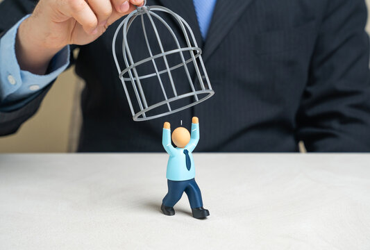 A businessman is trying to trap an employee in a cage. Stop them from quitting or fire them. Workplace coercion and violation of workers rights concept.