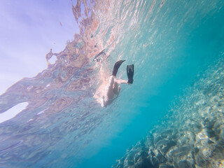 Artistic Low Angle Underwater View of a Woman Snorkeling in Crystal Clear Turquoise Water of Mediterranean Sea Saint-Jean-Cap-Ferrat France © Dmitri