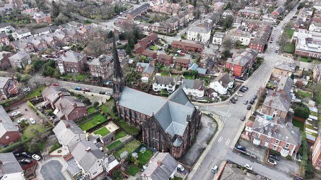 Aerial view of Christ Church Birkenhead under bright sunlight and clear skies.