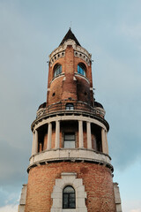 Fototapeta premium Gardos Tower in Zemun rising against clear sky, showcasing red brick architecture and historic landmark overlooking Belgrade and Danube.