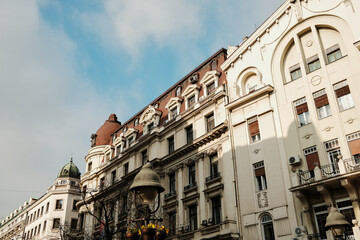 Fototapeta premium Row of historic residential buildings under blue sky creating classic European cityscape in Belgrade.