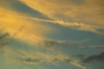 Obraz premium Cloudy sunny blue and yellow toned sky with dreamy atmosphereg sky with clouds and sunlight
