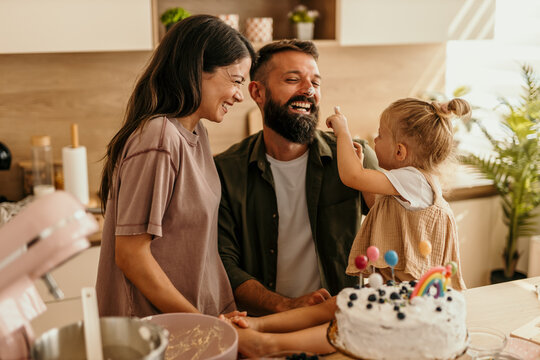 Happy family enjoying a birthday celebration at home