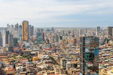Fototapeta premium Modern office downtown skyscrapers buildings with residential areas in rapidly developing Phnom Penh central business district panorama, Cambodia