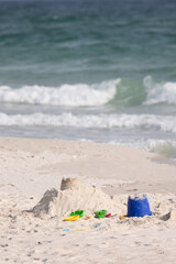 Sand Toys and Sandcastle on Gulf Shores Beach in Alabama During Daytime on a Sunny Day