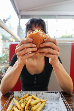 Enjoying a vegan Burger With Fries at a Casual Dining Spot