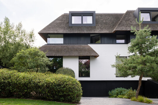 villa with thatched roof