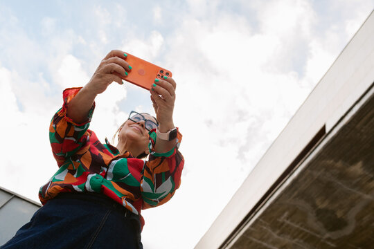 Woman Taking Selfies Cloudy Sky