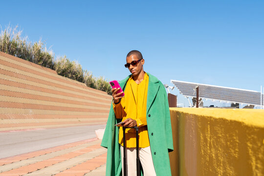 Traveler Checking Phone Outdoors