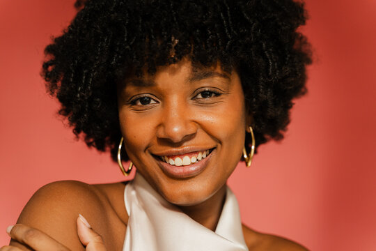 Beautiful woman stands in a studio setting
