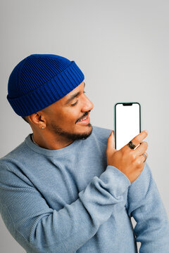 Casual holds a mockup phone
