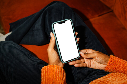 Anonymous woman uses smartphone with blank screen