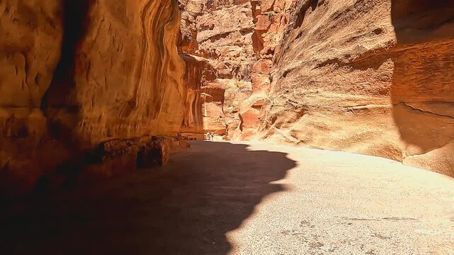 Petra, Jordan : Walking through the rose city of Petra to reach the Treasury (one of the Seven Wonders of the World) Life of ancient Arabs