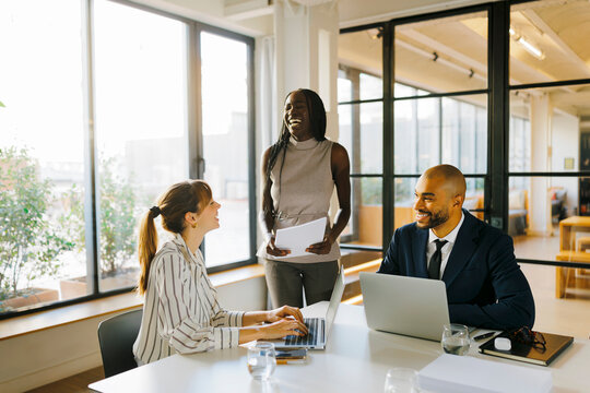 Business professionals collaborating during meeting at office