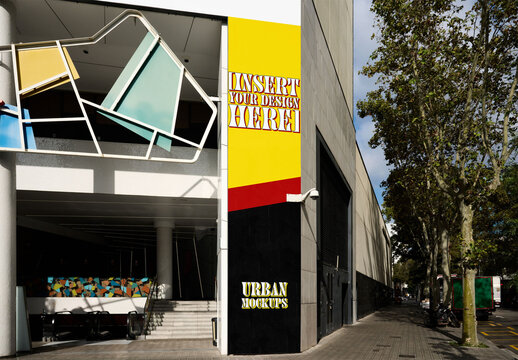 Real photo shows vertical advertising space at the entrance of a shopping center in Barcelona. PSD mockup