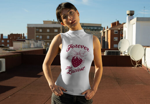 Real photo of woman stands on a rooftop wearing a fitted sleeveless t-shirt. PSD mockup.