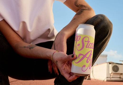 real photo of woman Holding a Blank Can on Rooftop. PSD mockup.