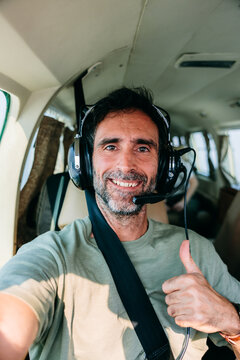Smiling Man Selfie In Small Plane Cockpit