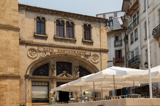 Ornate facade of the cafe restaurant Santa Cruz, historical portuguese style building in Praca 8 de Maio town square, Coimbra, Portugal
