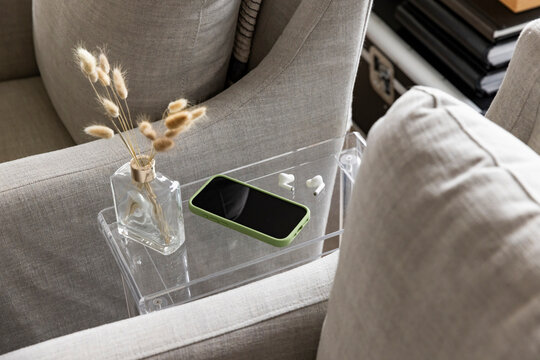 Blank Cell phone still life in luxury home earbud