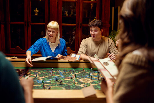 People engaged in a lively board game session