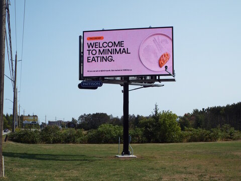 Ottawa, Ontario, Canada-July 16, 2025: A digital Pattison billboard displays a "The CDB Diet" advertisement on Hunt Club Road.