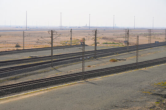 High-speed railway tracks of the Haramain High-Speed Railway stretching through the Saudi Arabian desert between Medina and Mecca
