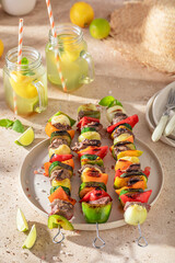 Tasty grilled skewer made of pepper, onion and beef.