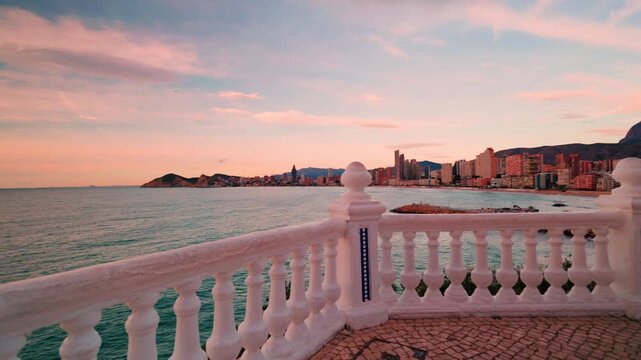 Benidorm skyline and poniente beach at sunset from balcon del mediterraneo