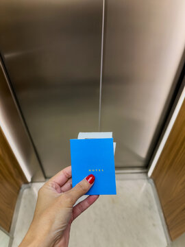 UGC photo of woman holding hotel room card inside elevator