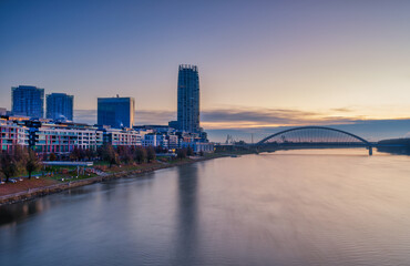 Fototapeta premium Eurovea Modern District and Apollo Bridge Over Danube River at Dawn