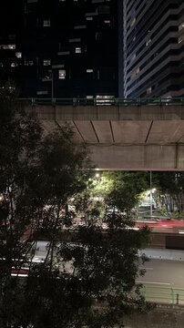 Urban freeway traffic motion blur at night in Mexico on elevated road, lock down camera Time - Lapsed