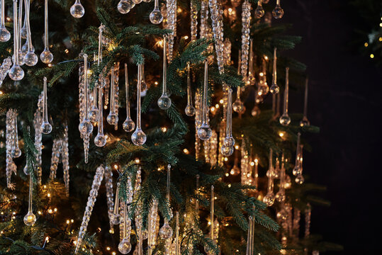 Christmas tree adorned with icicle ornaments and warm lights