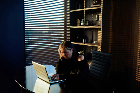 Woman working late at office