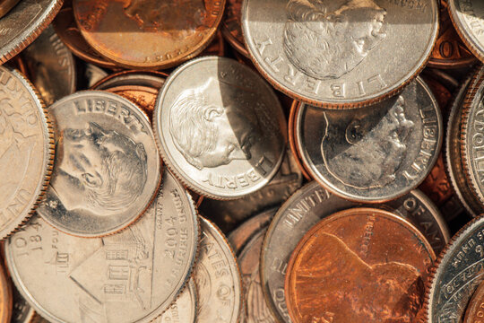 assorted American coins, pennies, dimes, nickels, quarters