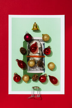 Christmas party concept on printed image of US dollar banknote roll