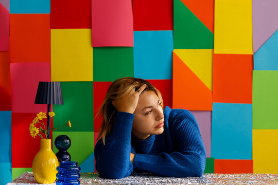 woman looking away against colorful background