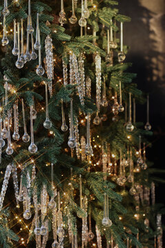 Elegant Christmas tree adorned with shimmering icicle ornaments 