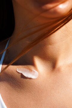 Skincare Cream Product on Shoulder Area in Summer Light