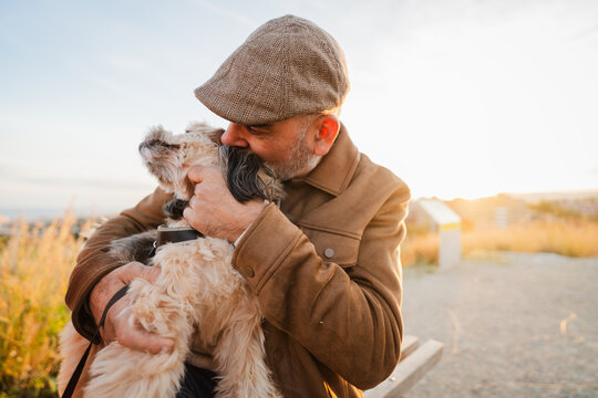 Man enjoys being outside with his dog