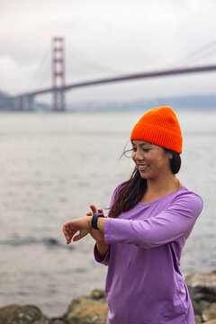Asian Athlete smart watch monitor performance 