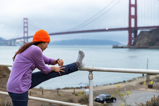 Asian Athlete stretch smart watch monitor performance 