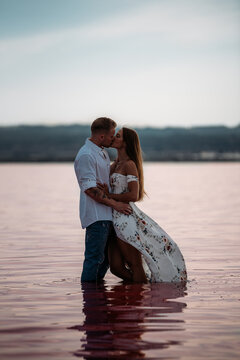 Romantic couple kissing in Pink Lake Torrevieja