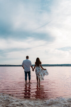 Couple enjoying The Pink Lake in Torrevieja, Spain
