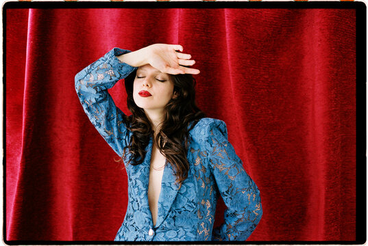 Dramatic close portrait of woman in lace suit