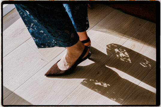 Close detail of feet and lace shadows