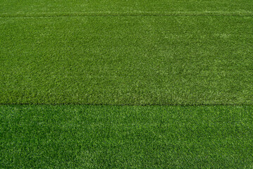 Artificial grass field. Green turf background